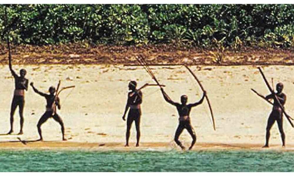 Sentinelese tribe warriors aiming bows and arrows on North Sentinel Island beach