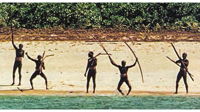 Sentinelese tribe warriors aiming bows and arrows on North Sentinel Island beach