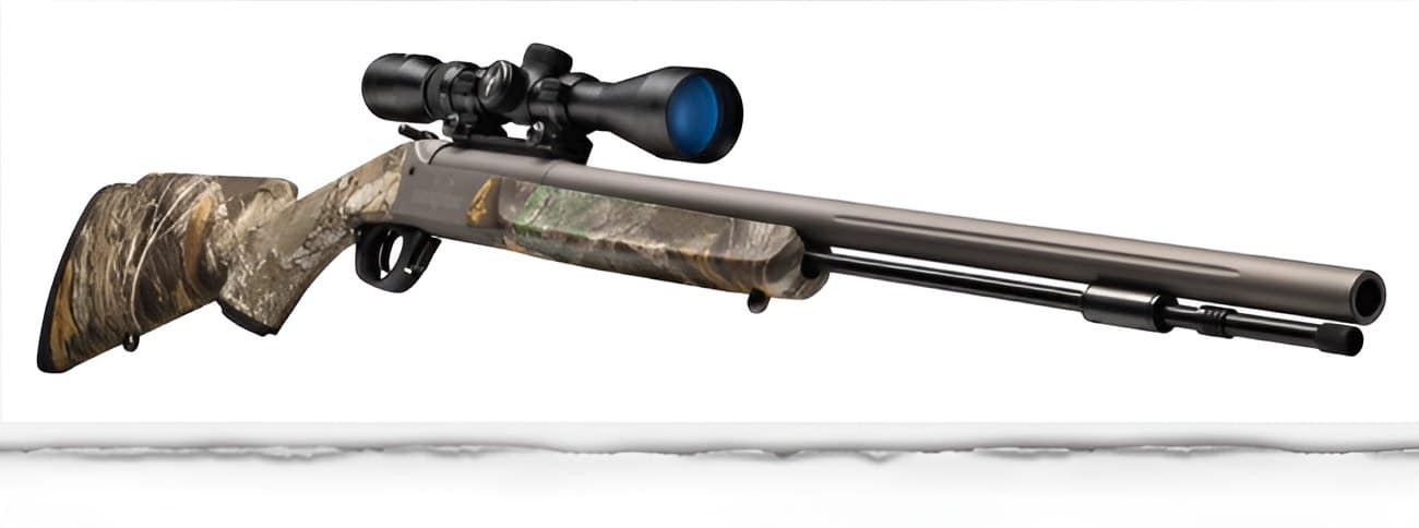 Camouflage-pattern bolt-action hunting rifle with a mounted scope on a white background.