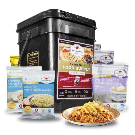 773308-Wise_Food_Emergency_Food_and_Drink_Storage_Prepper_Pack_52_Servings-1152 - Popular Outdoorsman Emergency food supply bucket with assorted Wise Company packets and a plate of prepared meal in front, for crisis storage or survival kits.