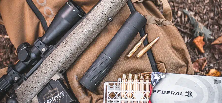 BANISH 30 Gold-V2 suppressor mounted on a bolt-action hunting rifle - Popular Outdoorsman BANISH 30 Gold-V2 suppressor mounted on a bolt-action hunting rifle